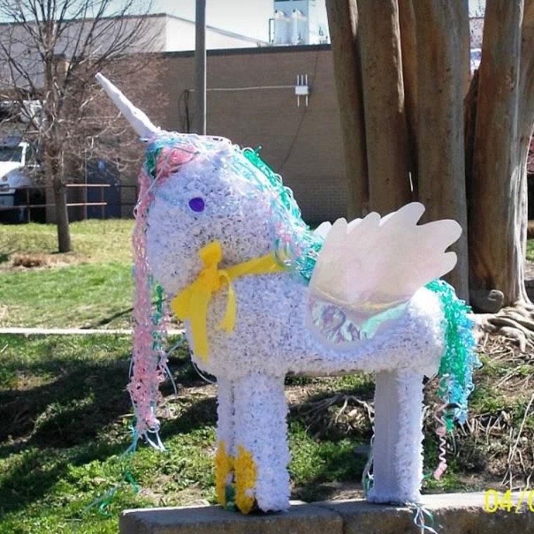 Handmade My Little Pony inspired unicorn piñata in white tissue paper with pastel mane, tail, and wings
